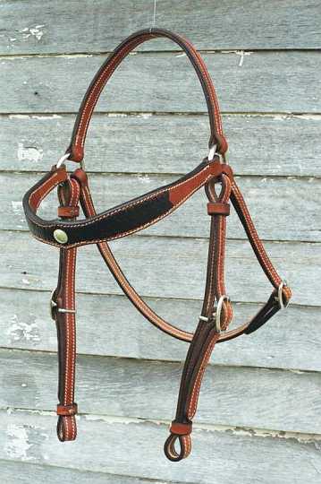 Stock bridle-1.jpg - Stock Bridle with Diamond Brow & Diamond Applique'
Bridle in Saddle Tan with Black roo hide Applique' - Silver concho centre piece.
Dressed with Stainless rings & swedge buckles
Leather Keepers.